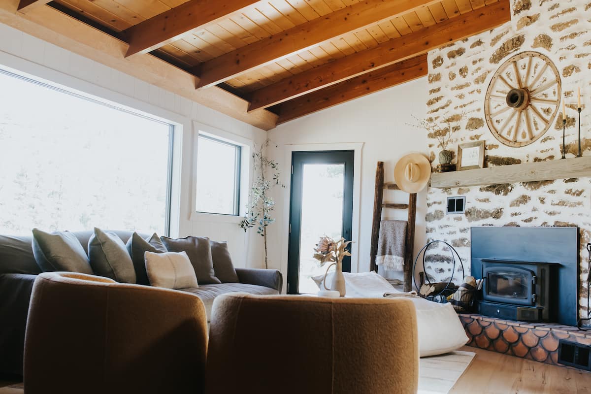 Cozy living room with wood-burning stove and exposed beams
